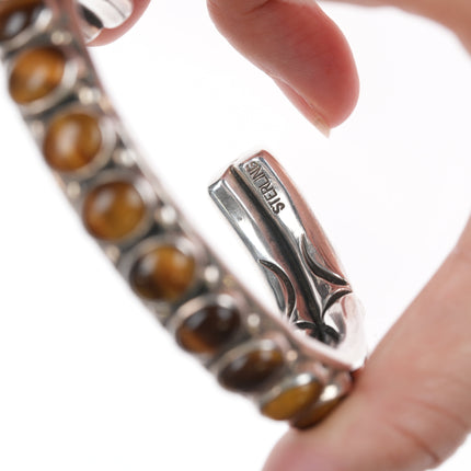 7" Orville Tsinnie Navajo hand stamped silver Cat's Eye row cuff bracelet