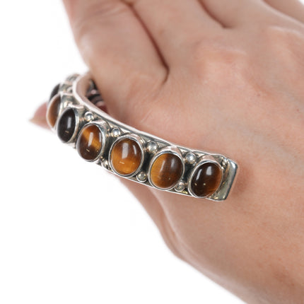 7" Orville Tsinnie Navajo hand stamped silver Cat's Eye row cuff bracelet