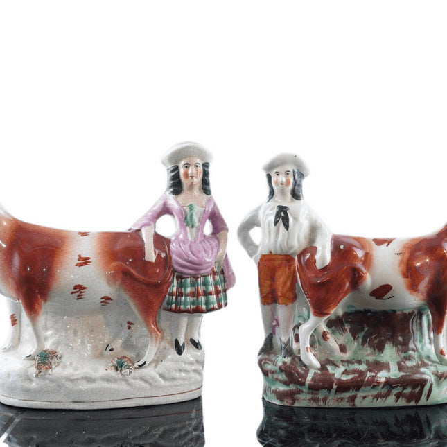 c1860 Staffordshire cow and farmer spill vases