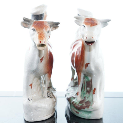 c1860 Staffordshire cow and farmer spill vases