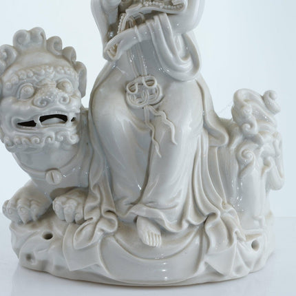 Antique Chinese Blanc de Chine porcelain Guanyin Boddhisattva with Foo Lion