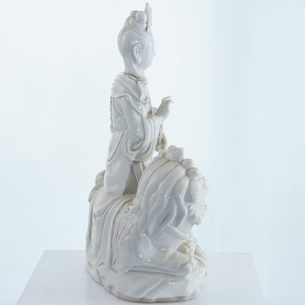 Antique Chinese Blanc de Chine porcelain Guanyin Boddhisattva with Foo Lion