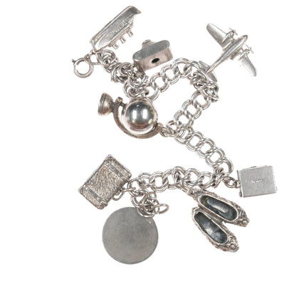 6.5" Vintage Sterling charm bracelet with airplane and others