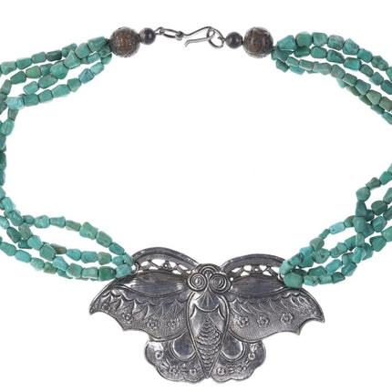 Artisan Sterling silver Oversized moth pendant strung on turquoise beads