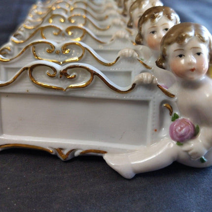 8 c.1920 German Porcelain Dinner Table Place Holders Cherubs