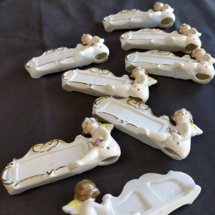 8 c.1920 German Porcelain Dinner Table Place Holders Cherubs