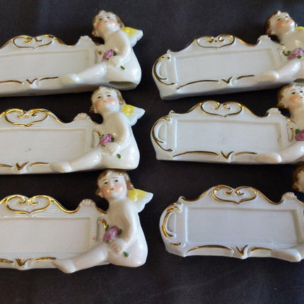 8 c.1920 German Porcelain Dinner Table Place Holders Cherubs