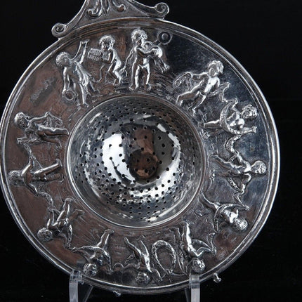 800 Silver Tea Strainer Allegorical Cherubs dancing and playing instruments