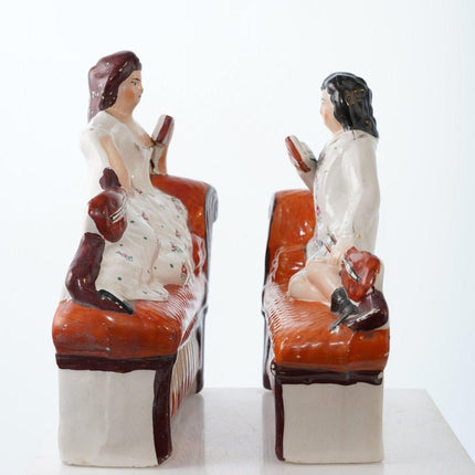 Antique Staffordshire Bookends Man and Woman reclining on sofa