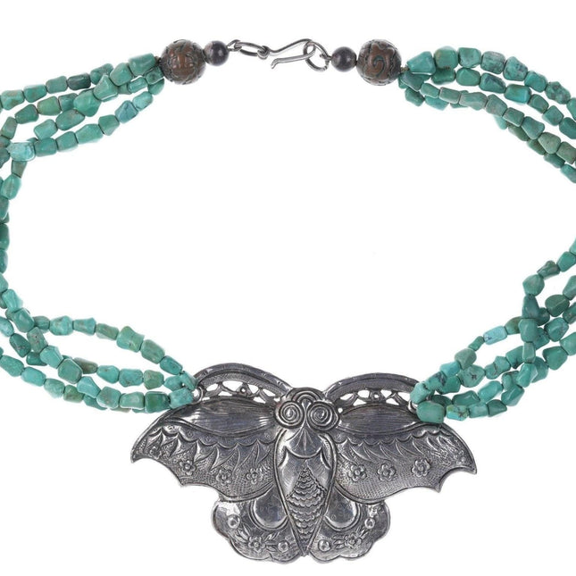 Artisan Sterling silver Oversized moth pendant strung on turquoise beads