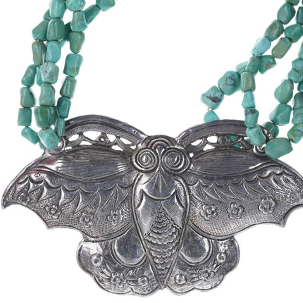 Artisan Sterling silver Oversized moth pendant strung on turquoise beads