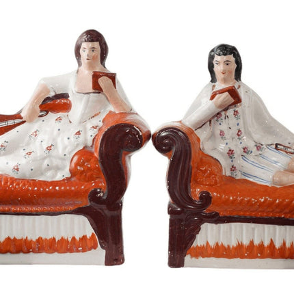 Antique Staffordshire Bookends Man and Woman reclining on sofa