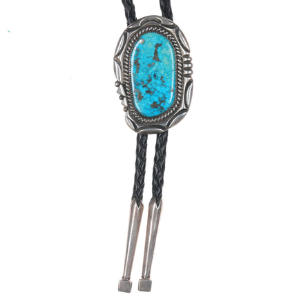 Orville Tsinnie (1943-2017) Large silver and turquoise bolo tie