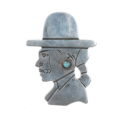 Vintage Navajo sterling portrait pin with spiderweb turquoise