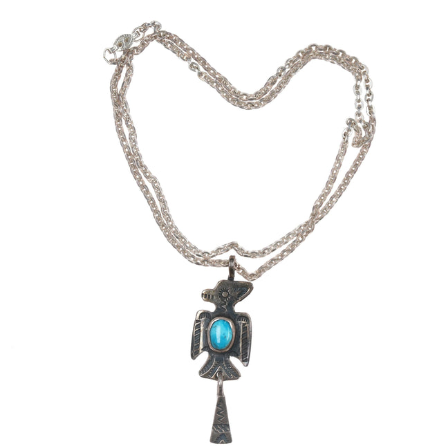 Chief Wolf Robe Hunt (1905-1977) Acoma Ingot silver and turquoise Thunderbird pendant