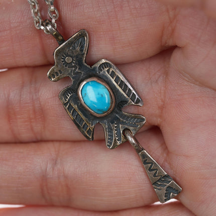 Chief Wolf Robe Hunt (1905-1977) Acoma Ingot silver and turquoise Thunderbird pendant