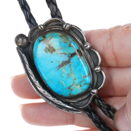 Vintage Native American silver and turquoise bolo tie with blossom tips