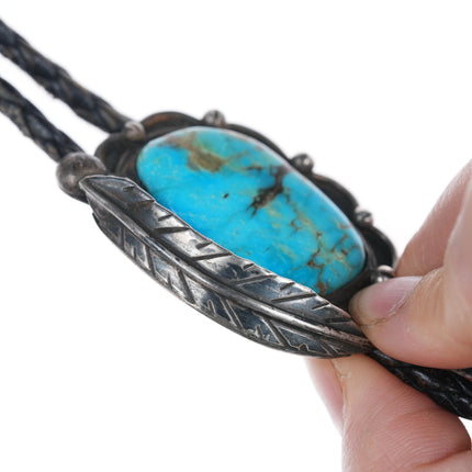 Vintage Native American silver and turquoise bolo tie with blossom tips