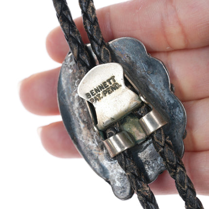 Vintage Native American silver and turquoise bolo tie with blossom tips