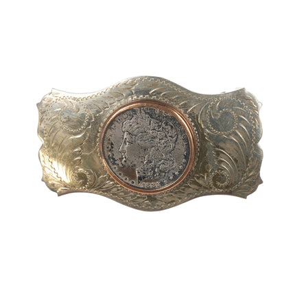 Comstock  1882 Silver dollar belt buckle in "German Silver" frame