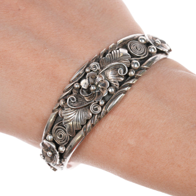 6 3/8" Edward Becenti Navajo sterling feather and blossom cuff bracelet