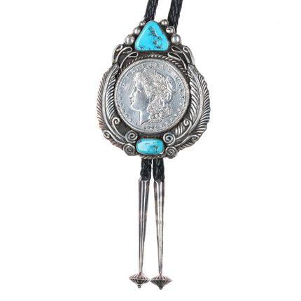 c1980 James Victor Begay Navajo sterling and turquoise bolo tie with 1921 dollar