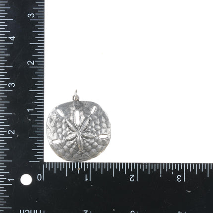 Retired James Avery sand dollar pendant in sterling