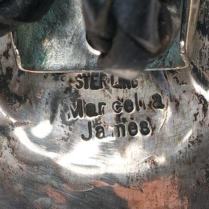 Marcella James Navajo heavily stamped sterling bolo tie