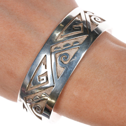 6.75" Bobby Sekakuku Hopi Overlay cuff bracelet Sterling w/coral inlay at terminal