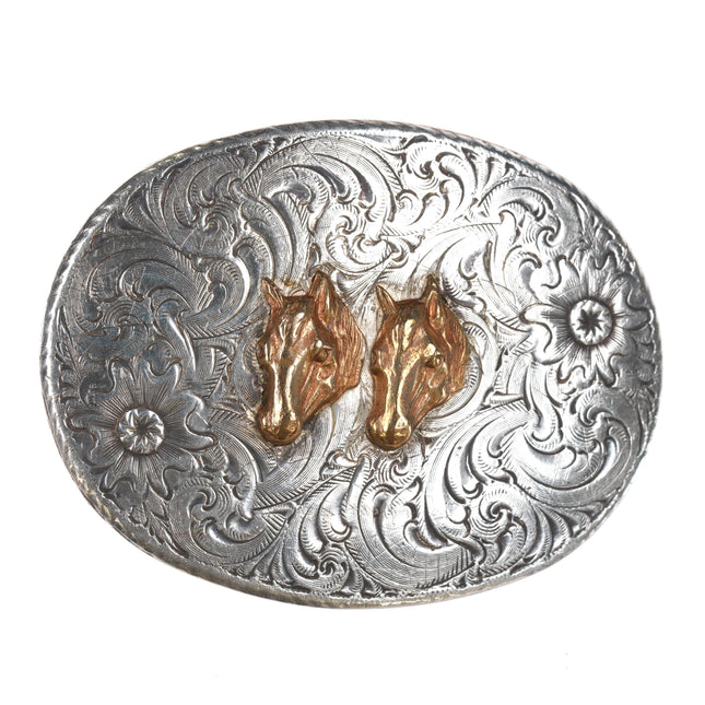 1980's Vogt Sterling front Cowboy belt buckle with Horse Heads