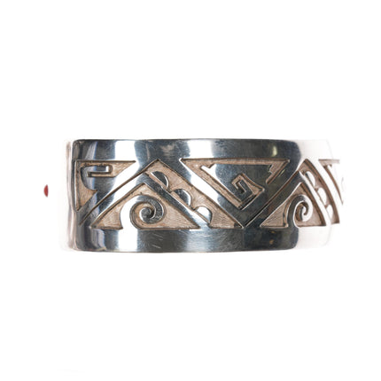 6.75" Bobby Sekakuku Hopi Overlay cuff bracelet Sterling w/coral inlay at terminal