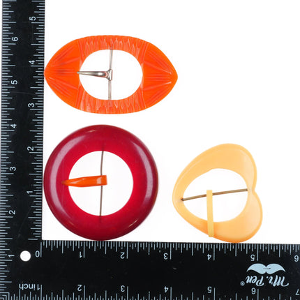 3 c1940's Bakelite Belt buckle sets circular Red, Butterscotch