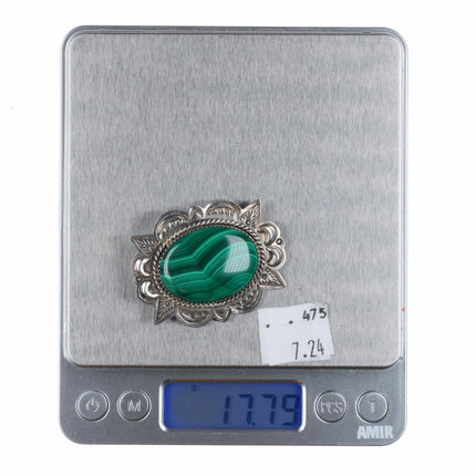 A Secatero Navajo sterling silver malachite hand stamped pendant/pin