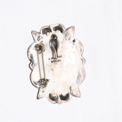 A Secatero Navajo sterling silver malachite hand stamped pendant/pin