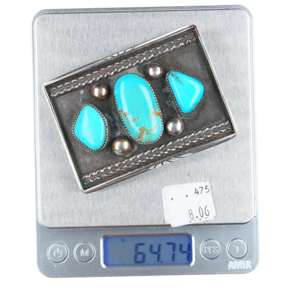Vintage Navajo sterling silver belt buckle with three turquoise