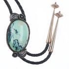 Vintage Southwestern sterling silver variscite bolo tie with feather designs