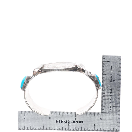 7" Vintage Navajo sterling silver cuff bracelet with turquoise dollar coin