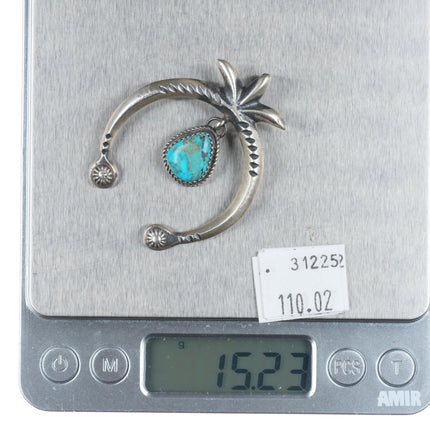 Mary Cayatineto Navajo sterling silver Naja pendant with turquoise