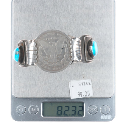 7" Vintage Navajo sterling silver cuff bracelet with turquoise dollar coin