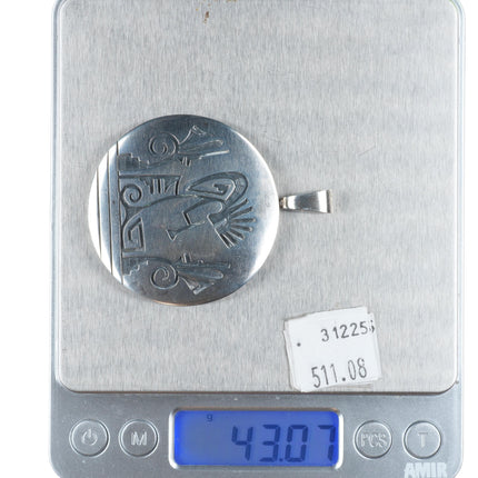 Cheryl Wadsworth Hopi overlay spinner kokopelli/sunface pendant sterling silver
