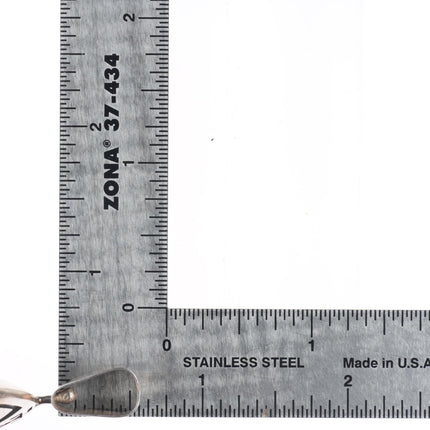 Hopi Overlay Man in the maze/bear sterling silver spinner pendant