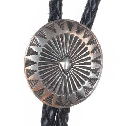 Vintage Navajo sterling silver bolo tie with stamped concho style slide