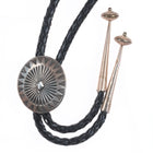 Vintage Navajo sterling silver bolo tie with stamped concho style slide