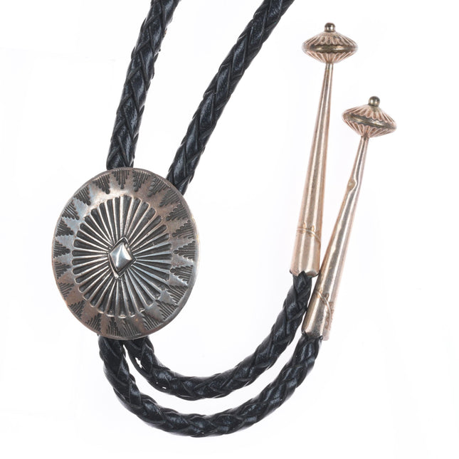 Vintage Navajo sterling silver bolo tie with stamped concho style slide