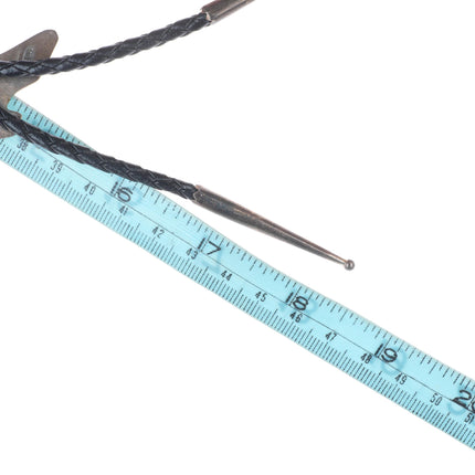 Vintage Southwestern sterling silver cowboy boot form bolo tie