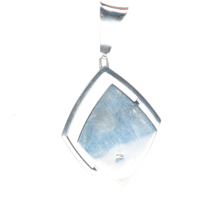 Richard Chavez San Felipe Pueblo coral, lapis, turquoise inlaid pendant