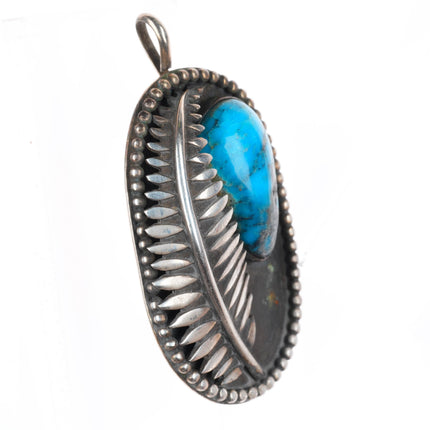 Vintage Native American sterling silver feather pendant with turquoise