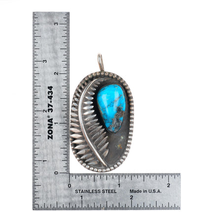 Vintage Native American sterling silver feather pendant with turquoise