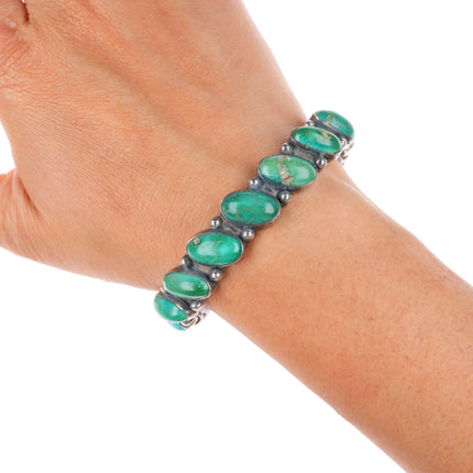 6.5" vintage Navajo greasy green turquoise row sterling silver cuff bracelet