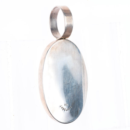 Ric Laselute Zuni sterling silver Morenci Turquoise orange coral sunface pendant